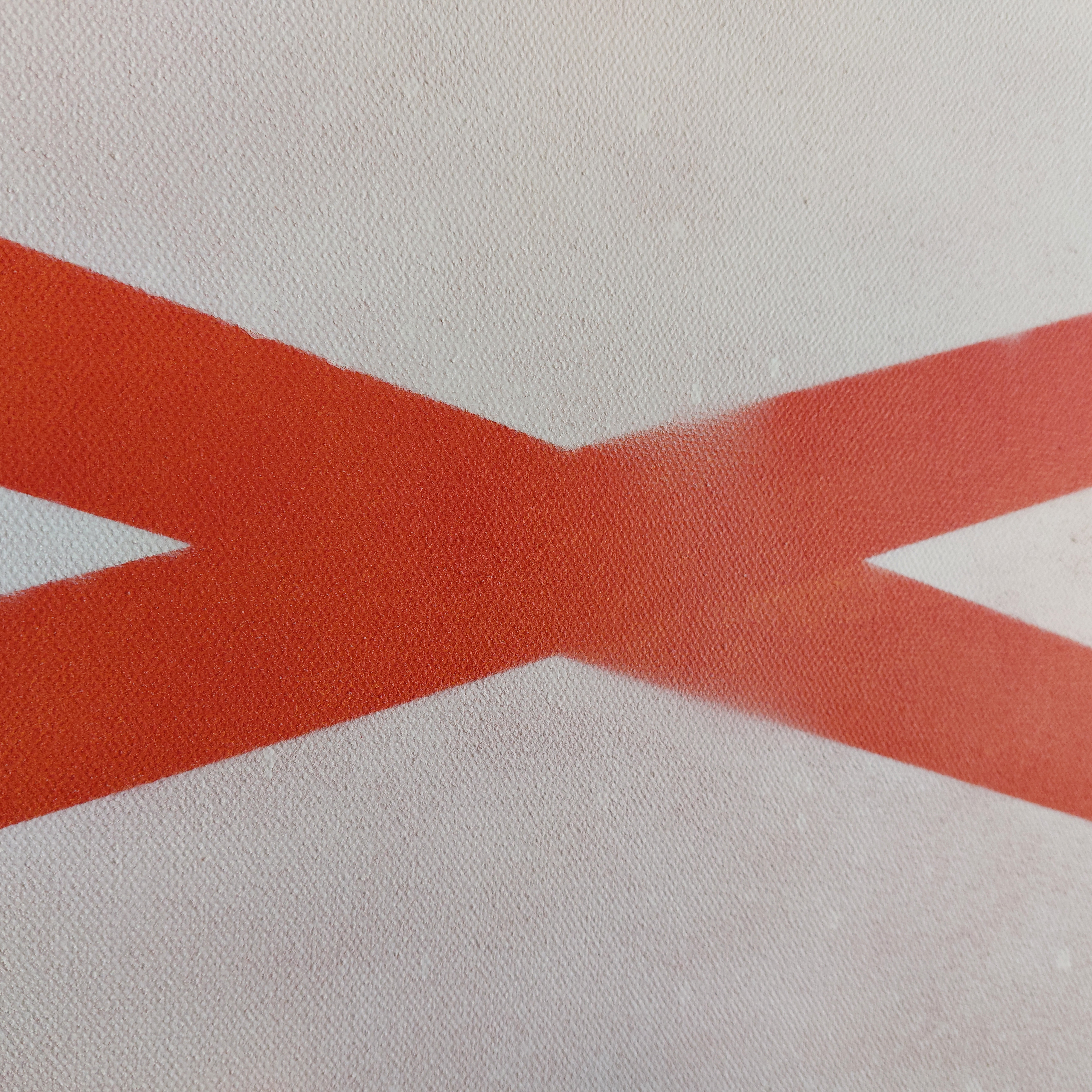 A picture of bad spray paint coverage on a canvas.