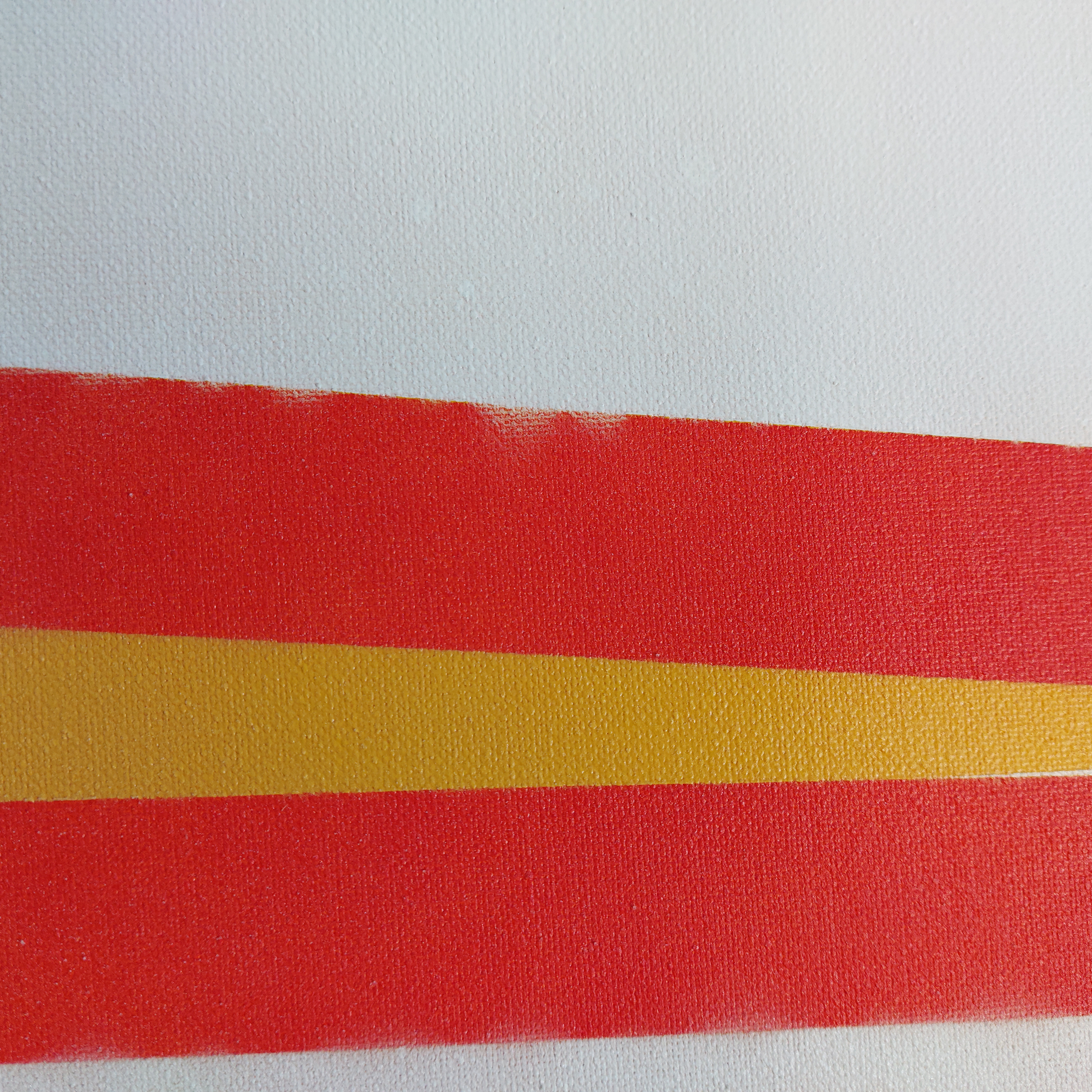 A picture of bad painter's tape placement on a canvas.
